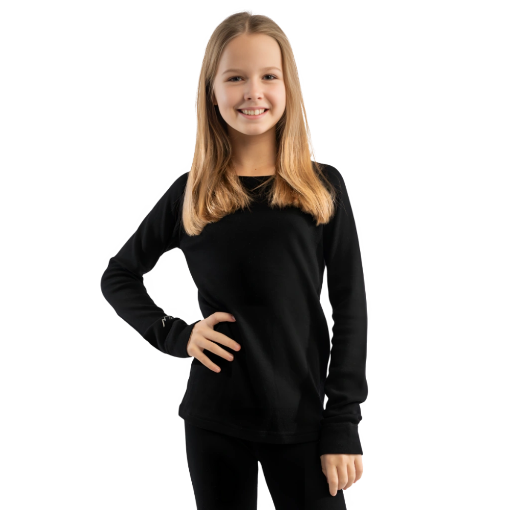 Young girl wearing a black long-sleeve top on a white background